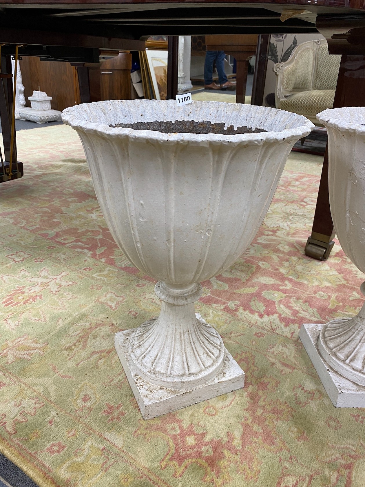 A set of four Victorian painted cast iron garden urns, diameter 38cm, height 53cm
